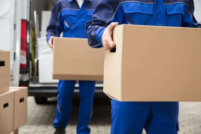 Delivery man carrying a box